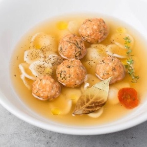 Chicken broth with meatballs