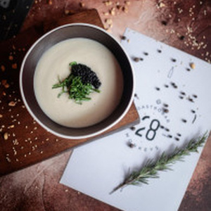 Cream soup of cauliflower and black caviar