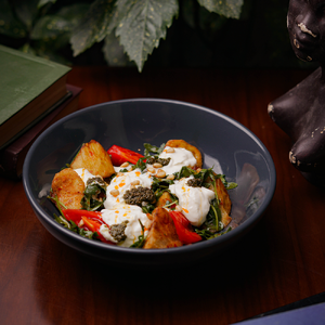 Warm salad with crispy eggplant and stracciatella cheese