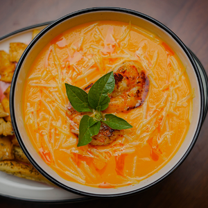 Creamy pumpkin soup with shrimps