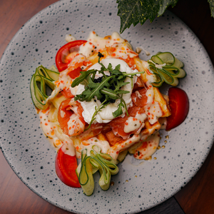 Pancakes with salmon, avocado, cottage cheese and guacamole sauce