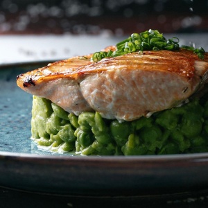 Grilled trout with young green peas